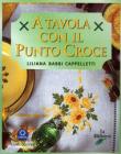 A tavola con il punto croce